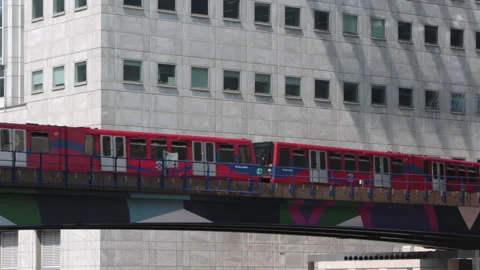 DLR subway train leaving Canary Wharf station Stock Footage 141200710