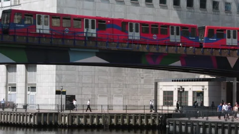 DLR subway train leaving Canary Wharf station Stock Footage 141201194