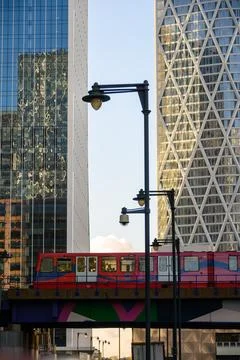 DLR train on bridge in front of modern buildings Stock Photos