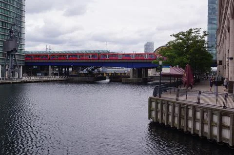 A DLR train crossing the bridge over North Dock in Canary Wharf, London (UK) Stock Photos