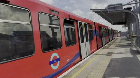 DLR train leaving Royal Albert Stock Footage 237198144