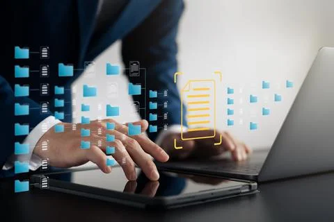 DMS document management system, company employees manage folders via laptops. Stock Photos
