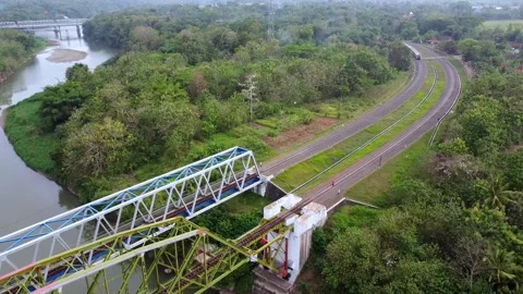 DMU passing a bridge in Jogja Video stock 230198486