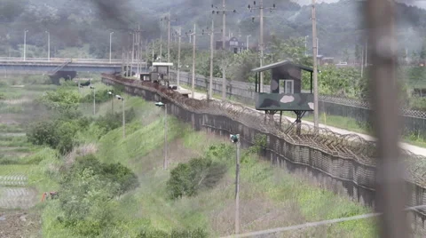 DMZ Panmunjon North Korean border observation towers through barber fences Stock Footage 3185305