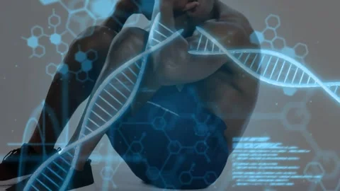 On DNA code overlays appearing over torso, man doing sit-ups in studio showing Stock Footage 330603030
