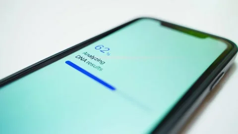 DNA results analyzing progress on smartphone screen completes with report ready Video stock 342602747