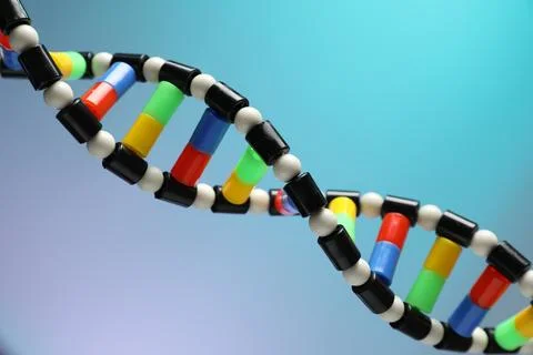 DNA structure model on color background, closeup Stockfoto's