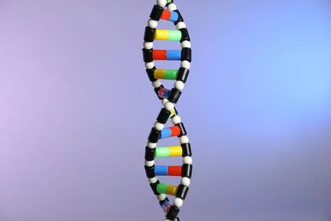 DNA structure model on color background, closeup Foto stock