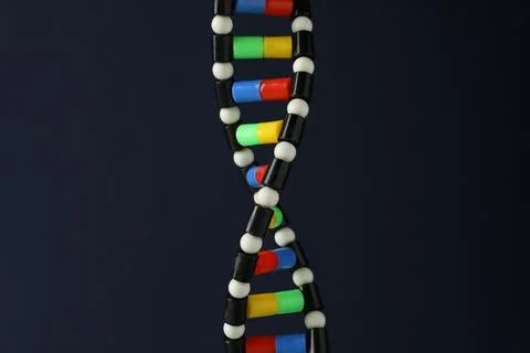DNA structure model on dark background, closeup 写真素材