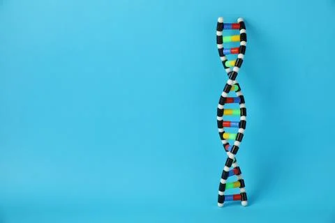 DNA structure model on light blue background, space for text Stock Photos