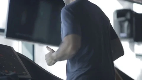 Dnipro March 2017. Young athletic man  running on treadmill in sport gym.  Stock Footage 81206952