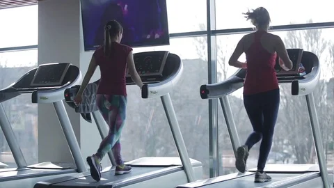 Dnipro March 2017. Young athletic women running on treadmill in sport gym.  Stock Footage 81207104