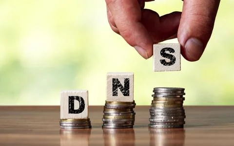 DNS  concept of the domain name system on wooden cube - network symbol Stock Photos