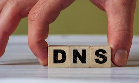 DNS  concept of the domain name system on wooden cube - network symbol Stock Photos
