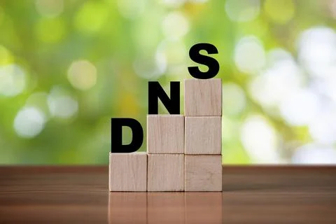 DNS  concept of the domain name system on wooden cube - network symbol Stock Photos
