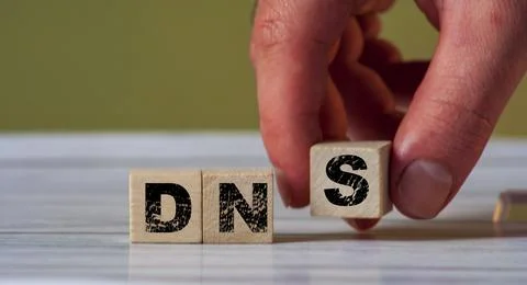 DNS  concept of the domain name system on wooden cube - network symbol Stock Photos