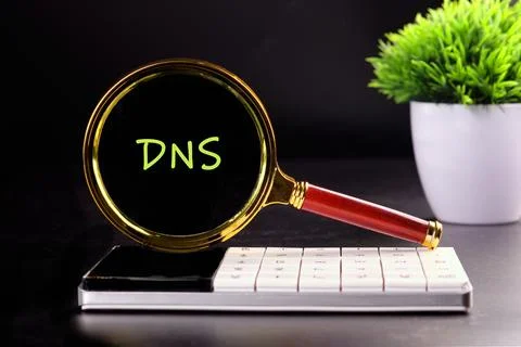 DNS Domain Name Server through the lens of a magnifying glass in the dark Stock Photos