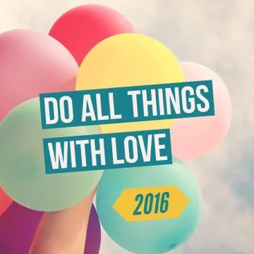 Do all things with love in 2016 with hand holding colorful balloons Foto stock