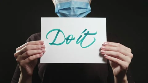 Do it coronavirus self-isolation woman mask slogan Stock Footage 134723984