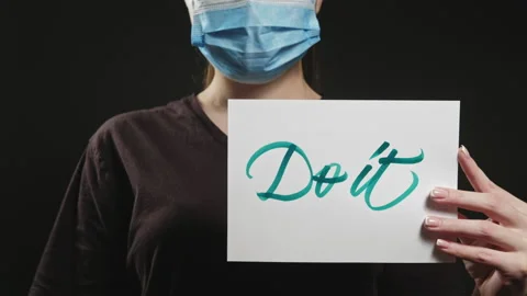 Do it covid-19 pandemic woman mask aspirational Stock Footage 134897365