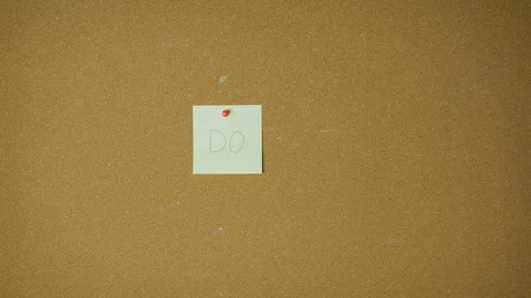 Do it. Hands pining sticky notes on pin board funny animation Stock Footage 98519619