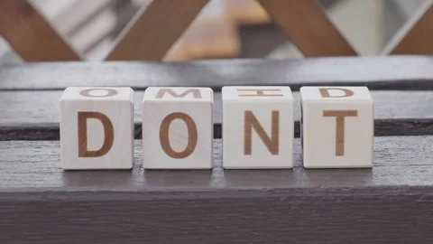 Do it, motivational phrase, laying out  by hand from letters on wooden cubes Stockbeeldmateriaal 342134892
