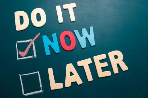 Do It Now or Later with checkbox and red check on blackboard Stock Photos