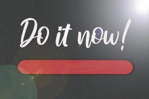 Do It Now word drawn on black background. Motivational concept. Foto stock