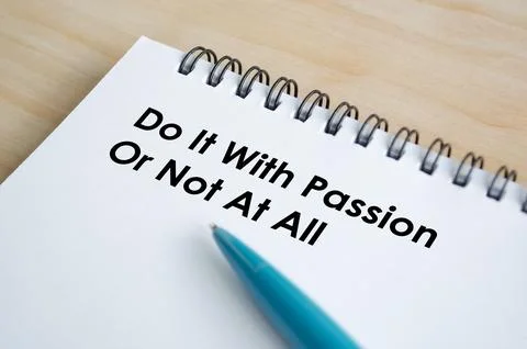 Do It With Passion Or Nothing At All text written on a spiral notepad with .. Stock Photos