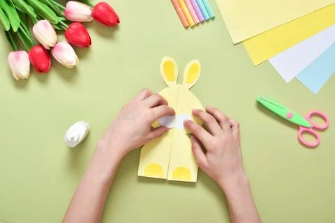 Do it yourself. A children's postcard made of paper with a rabbit. Step-by-st Stock Photos