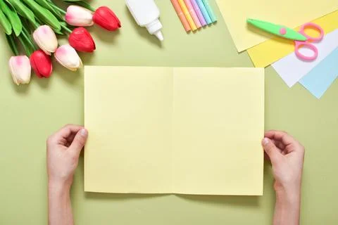 Do it yourself. A children's postcard made of paper with a rabbit. Step-by-st Photos