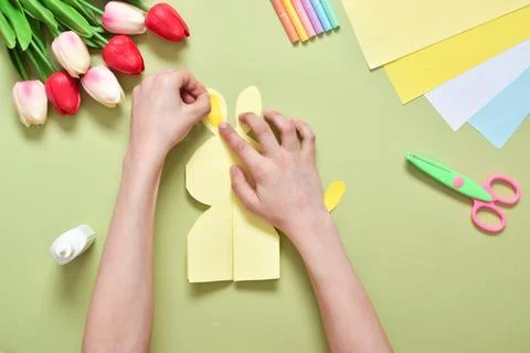 Do it yourself. A children's postcard made of paper with a rabbit. Step-by-st Stock Photos