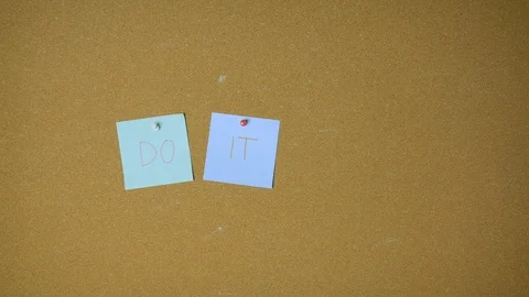 Do it yourself. Hands pining sticky notes on pin board funny animation Stock Footage 98519380