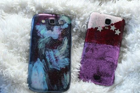 Do it yourself - new back cover on mobile phone Stock Photos