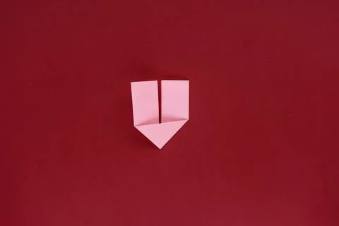 Do-it-yourself paper bookmark for a book in the shape of a heart. Confessio.. Photos