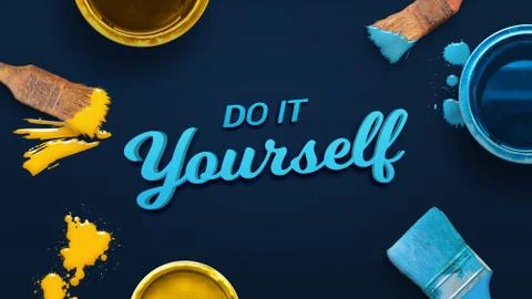 Do it yourself text surrounded by color brushes and boxes on the blue surface Stock Photos