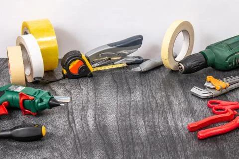 Do it yourself tools on grey wooden background. DIY tools with copy space for Stock Photos