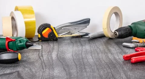 Do it yourself tools on grey wooden background. DIY tools with copy space for Stock Photos