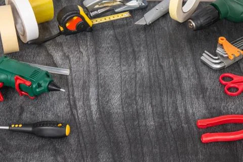 Do it yourself tools on grey wooden background. DIY tools with copy space for Stock Photos