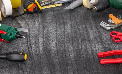 Do it yourself tools on grey wooden background. DIY tools with copy space for Stock Photos