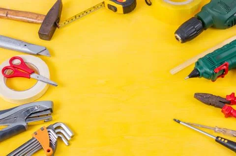 Do it yourself tools on yellow background. DIY tools with copy space for text Stock Photos