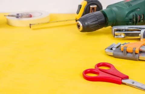Do it yourself tools on yellow background. DIY tools with copy space for text Stock Photos