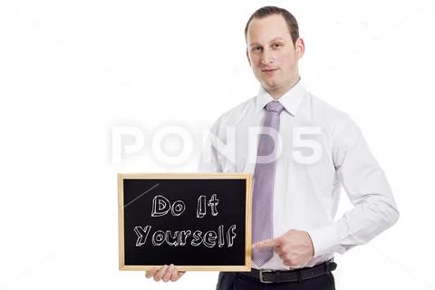 Do It Yourself - Young businessman with blackboard Stock Photos