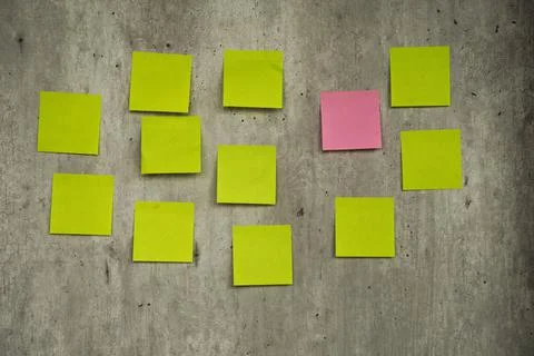 A To Do List with colorful note papers on cement wall background Stock Photos