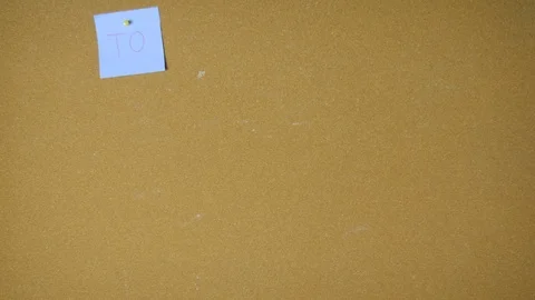 To do list for designer. Hands pining sticky notes on pin board funny animation Stock Footage 98516457