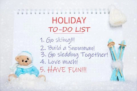 To-do list for the holidays. Notepad with to-do list: skiing, making a snowma Stock Photos