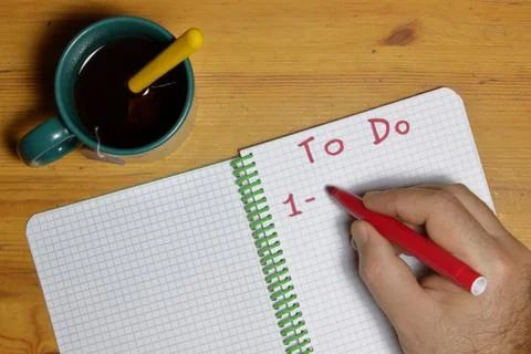 To do list with a man hand with red marker writing point one Stock Photos
