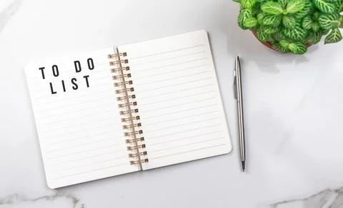 To do list for next year. Empty notebook on white table. Office desktop backg Stock Photos