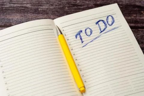 To do list in opened business notebook and pen Stock Photos