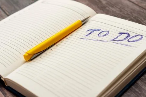 To do list in opened business notebook and pen Stock Photos